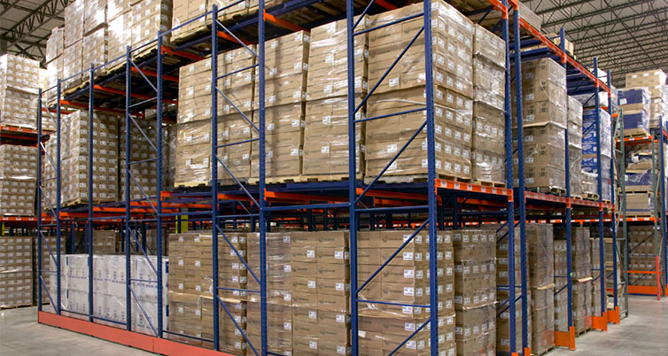 Pushback rack lanes with nested carts holding pallets several deep